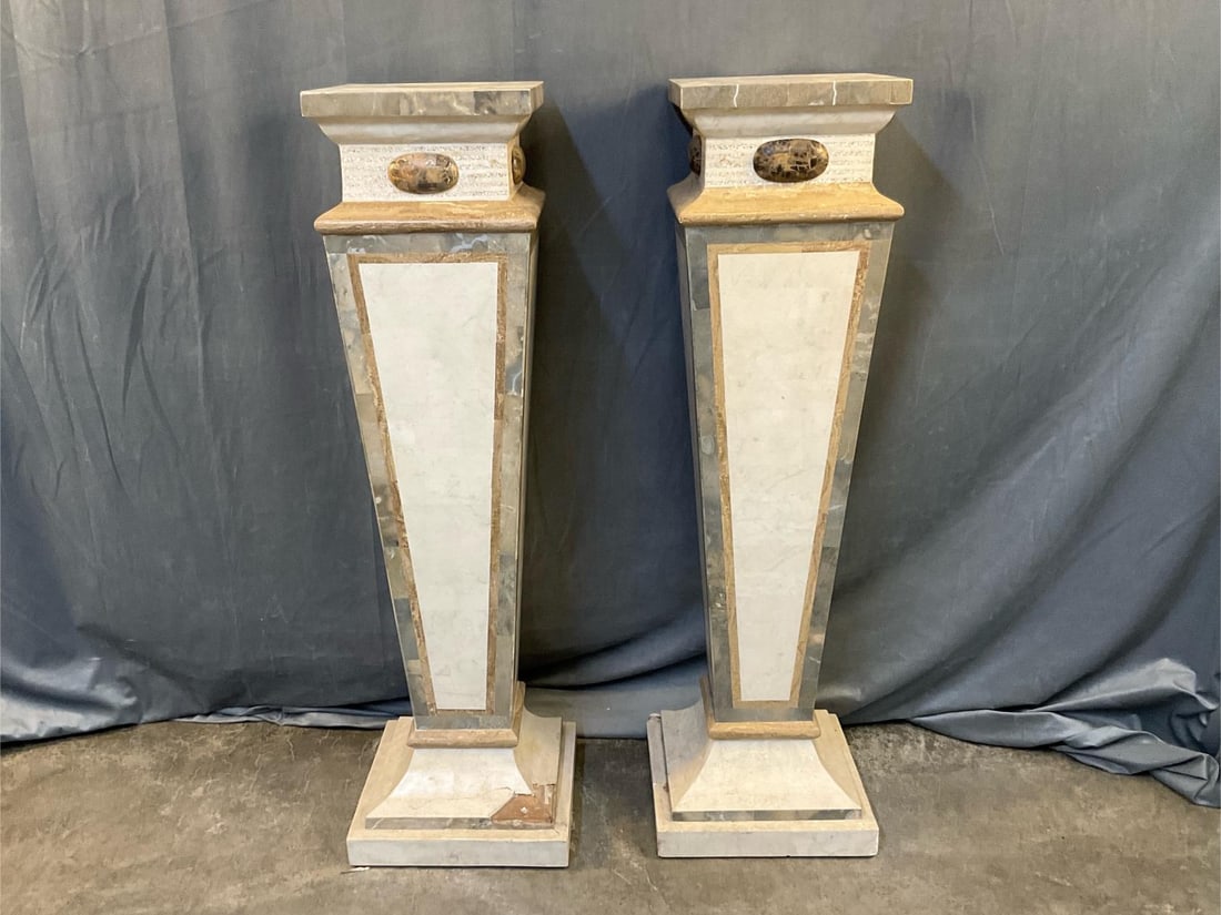Pair of Pedestals: Contemporary late twentieth century pair of tessellated faux marble pedestals. Some cracking and losses to both pedestal bases, otherwise good condition. Measures 13.25 inches wide x 13.25 x 44