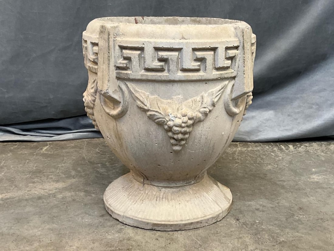 Neoclassical Concrete Planter: Late twentieth century neoclassical concrete planter with molded Greek key border and grapes. Chip to base, otherwise good condition. Measures 14.75 inches in diameter x 16.5 inches tall.