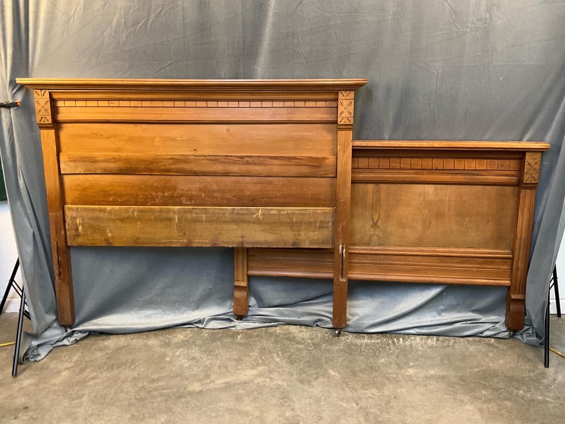 Eastlake Bed: Late 19th century Eastlake Style walnut headboard and footboard on castors with missing side rails. Good condition. Measures 60.5 inches wide x 4.5 x 49.25 inches tall.