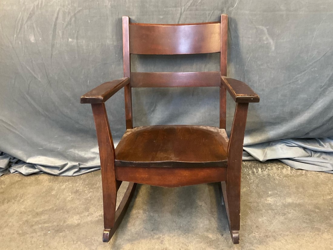 Rocking Chair: Mid-twentieth century vintage rocking chair. Good condition with some marks to finish. Measures 24.5 inches wide x 31 x 33 inches tall.