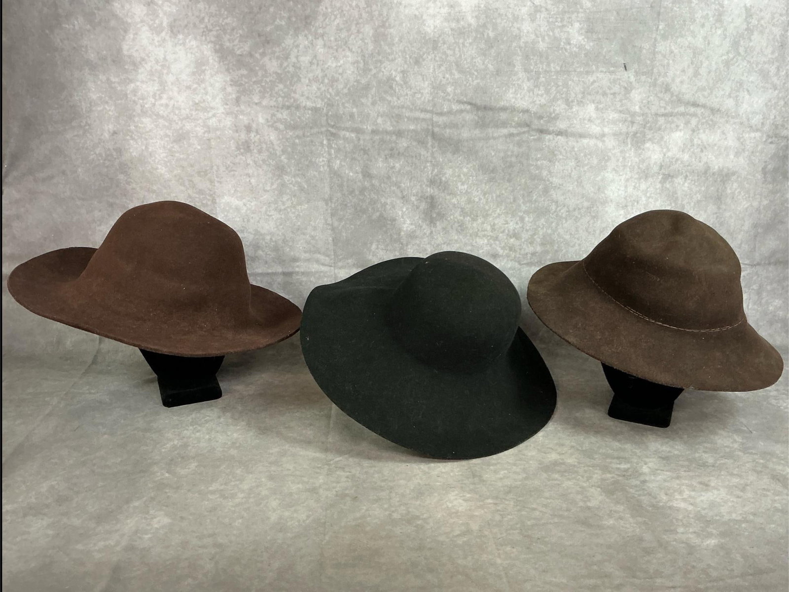 3 Felt Hats: Three heavy felt hats used for reenactment. One black and two brown in good condition. Black hat measures 15.5 inches in diameter x 6.5 inches tall.