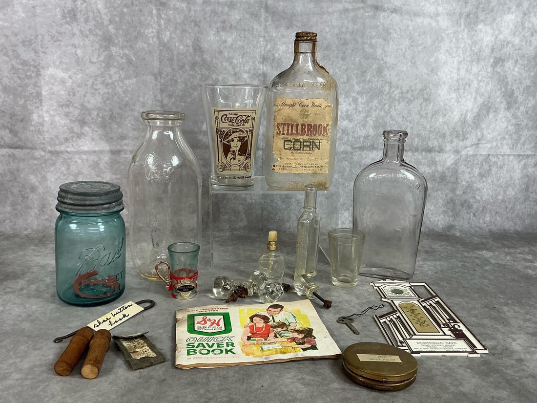 Collectible Bottles, Glass Knobs, Thermometer, & More: Twenty one early to mid century items. Clover Creamery Bottle, blue Ball canning jar, whiskey bottles, and shot glasses. Four glass pull knobs, book of Green Stamps, thermometer from a Pulaski Cafe,