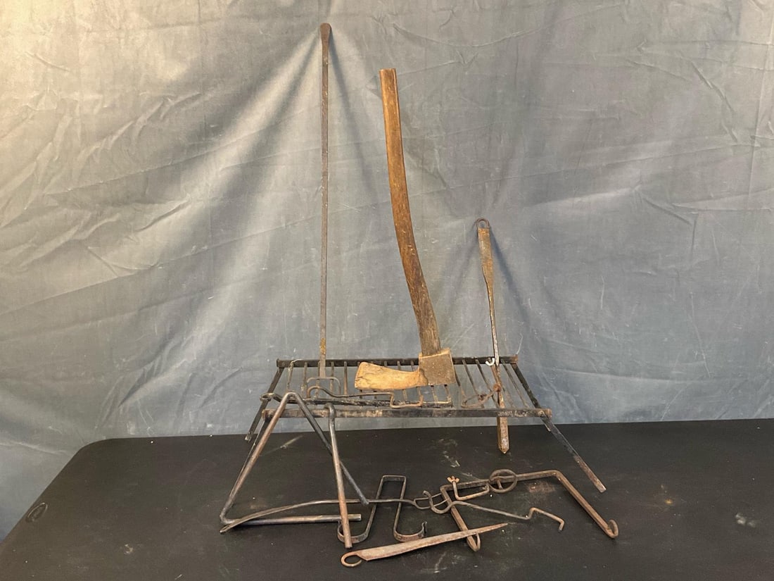 Reenactor Cooking: Lot of fifteen total vintage / reproduction iron camp cooking reenactor implements. One early 20th century hewing adze, one iron folding grill, one wrought iron cooking fork, one iron triangle dinner