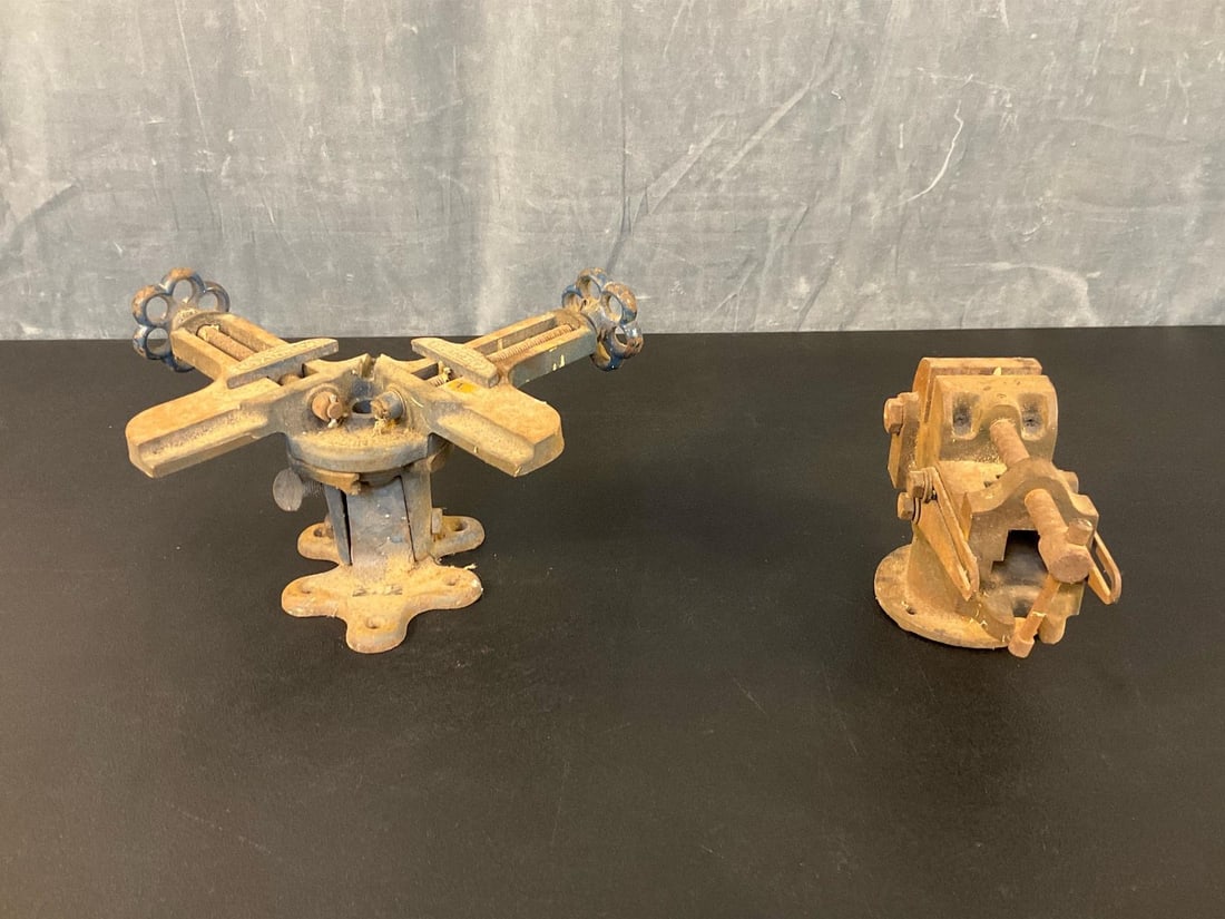 Cast Iron Vises: Two mid-twentieth century vintage cast iron vises. One vintage Stanley No. 400 tilting frame swivel miter vise. Made in the U.S.A. Marked. One vintage tilting drill press machinist 2 1/2” vise.