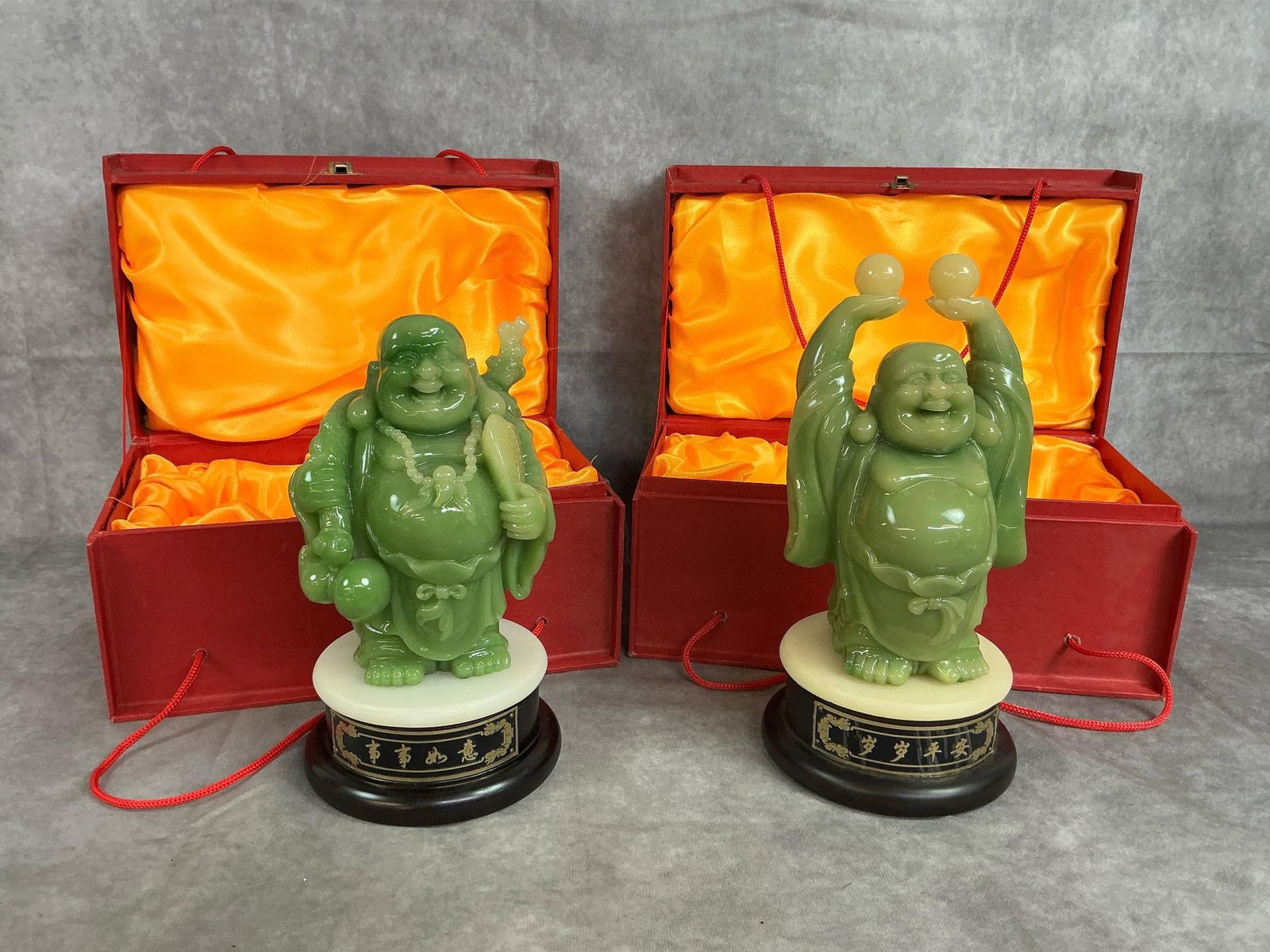 Laughing Buddha & Money Buddha: Two vintage faux jade buddha figures mounted on circular tile attached to swivel bases. "Laughing Buddha " and "Money Buddha " by Chulato Craft in original gift boxes. Both in good condition. Box