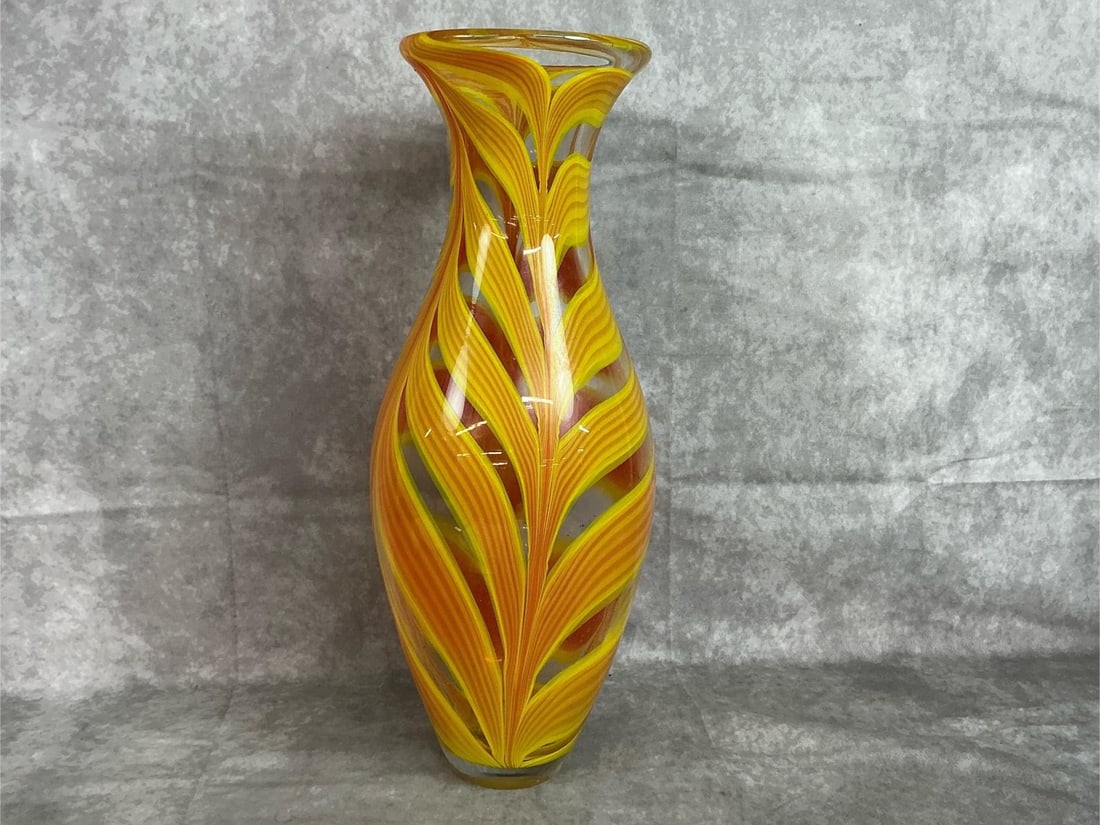 Art Glass Vase: Modern glass vase. Hand blown art glass vase with yellow and orange swirls. In good condition. Measures 6 inches in diameter at top rim x 18 inches tall.