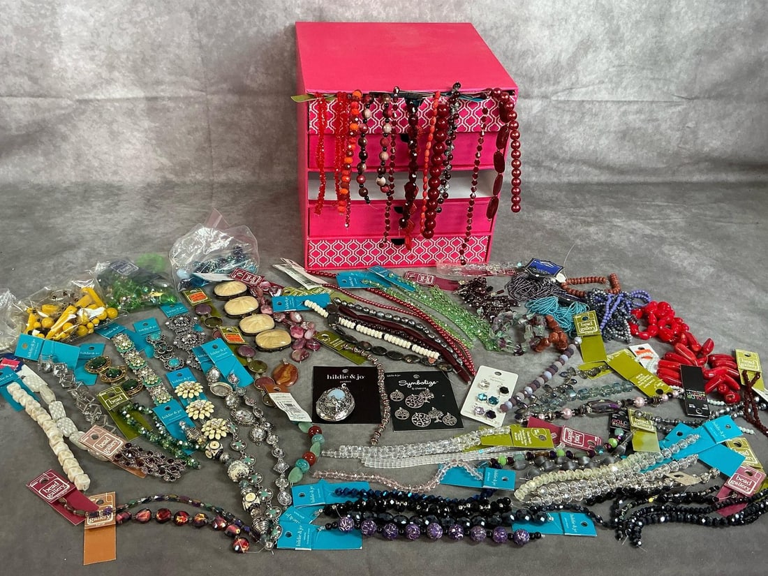 Jewelry Making Beads, Charms, & Slides: Lot contains over 60 bead strands and 15+ packs of beads, pendants, and charms. All sizes, colors, and designs still on cards. Includes pink five drawer storage box. Box measures 10 inches wide x 10