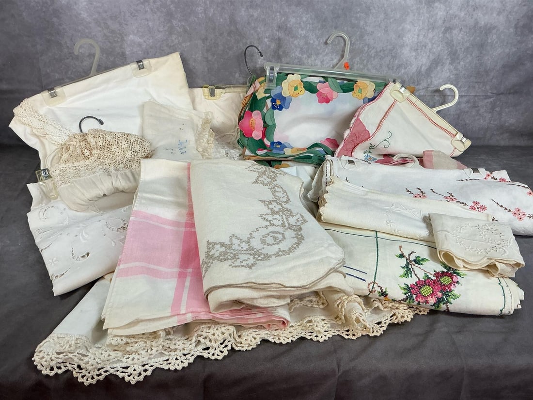 Tablecloths, Spreads & More: Mid century cloth pieces. Nine tablecloths with lace, crochet and other handiwork. Includes dresser scarves, baby pillow covers, floral spreads and more. Some items are stained with age. Pink and