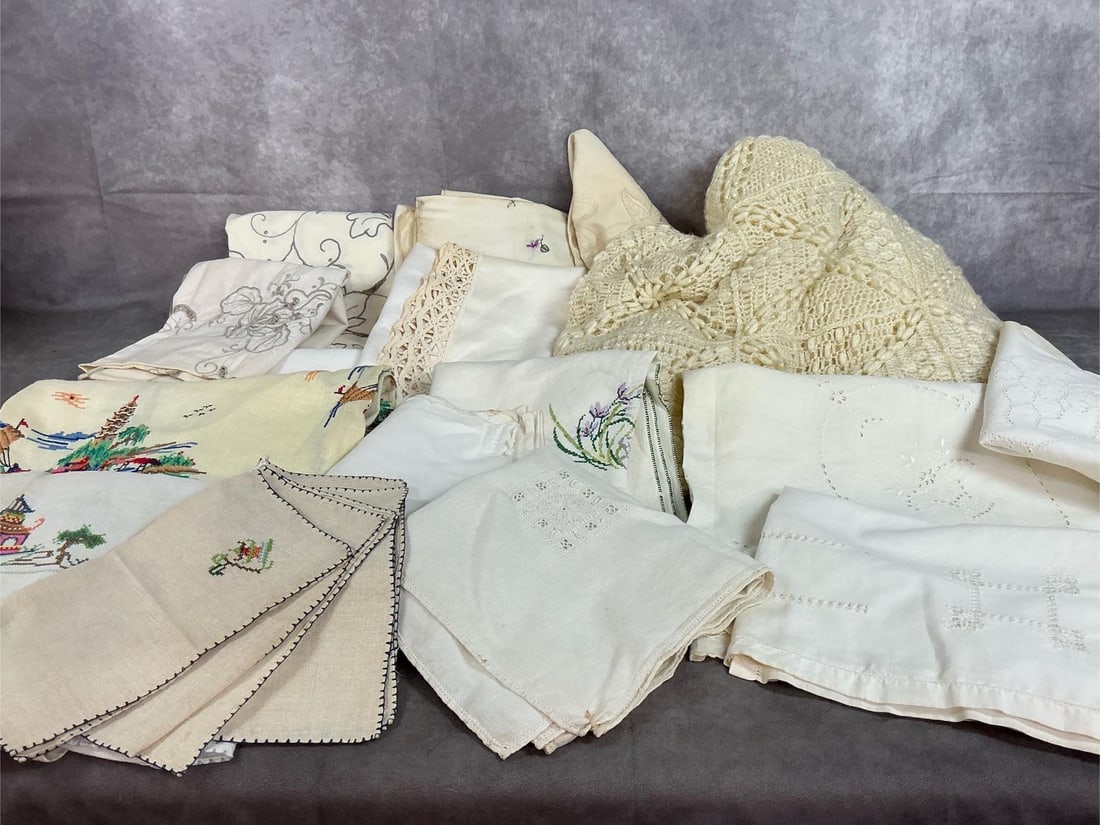 Afghan, Table Runners, Spreads & More: Fifteen mid century cloths and covers. Crocheted afghan, dresser scarves, spreads, and more. Hand stitched and embroidered. Visible stains on some items. Afghan measures 54 inches wide x 62 inches