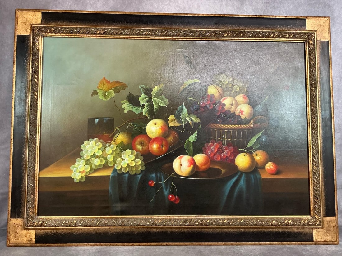 Fruit Still Life: Vintage large canvas print of fruit arrangement in gilded black and gold ornate frame. In good condition. Measures 43 inches wide x .5 x 31 inches high.