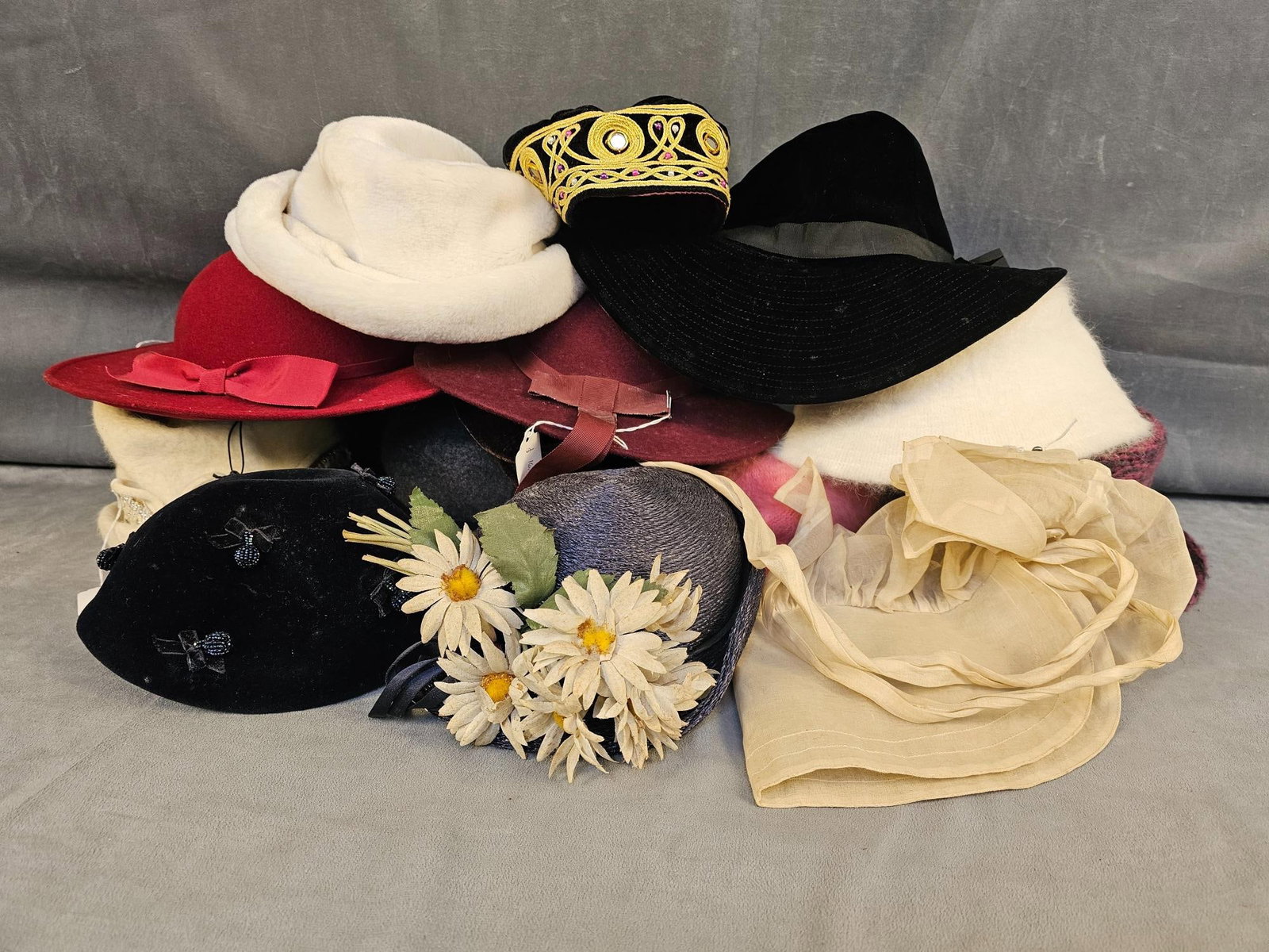 Ladies Hats: Fifteen vintage ladies hats in various styles and time periods. Brands include Countess, Lockers, Brandt, and more. Largest measures 14 inches in diameter.