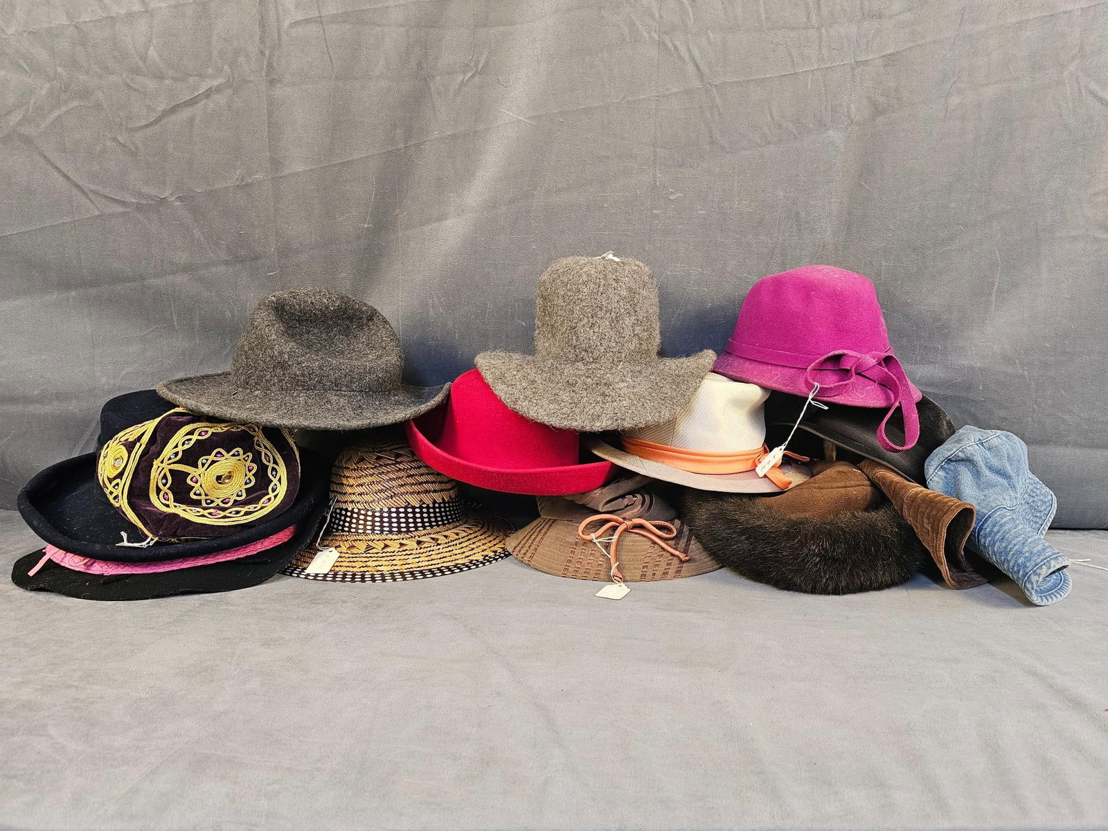 Ladies Hats: Sixteen vintage ladies hats in various styles and time periods. Brands include London Fog, Holland Hat Co, and more. Largest measures 16 inches wide x 4.5 inches tall.