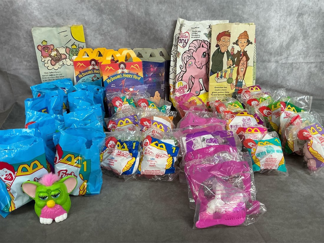 Happy Meal Toys: Forty McDonald's toys from 1998 to 2005. Includes Furby, My Little Pony, Mulan, Recess, and Winnie the Pooh. Boxes and bags included. Average bag is 4 inches wide x 5 inches tall.
