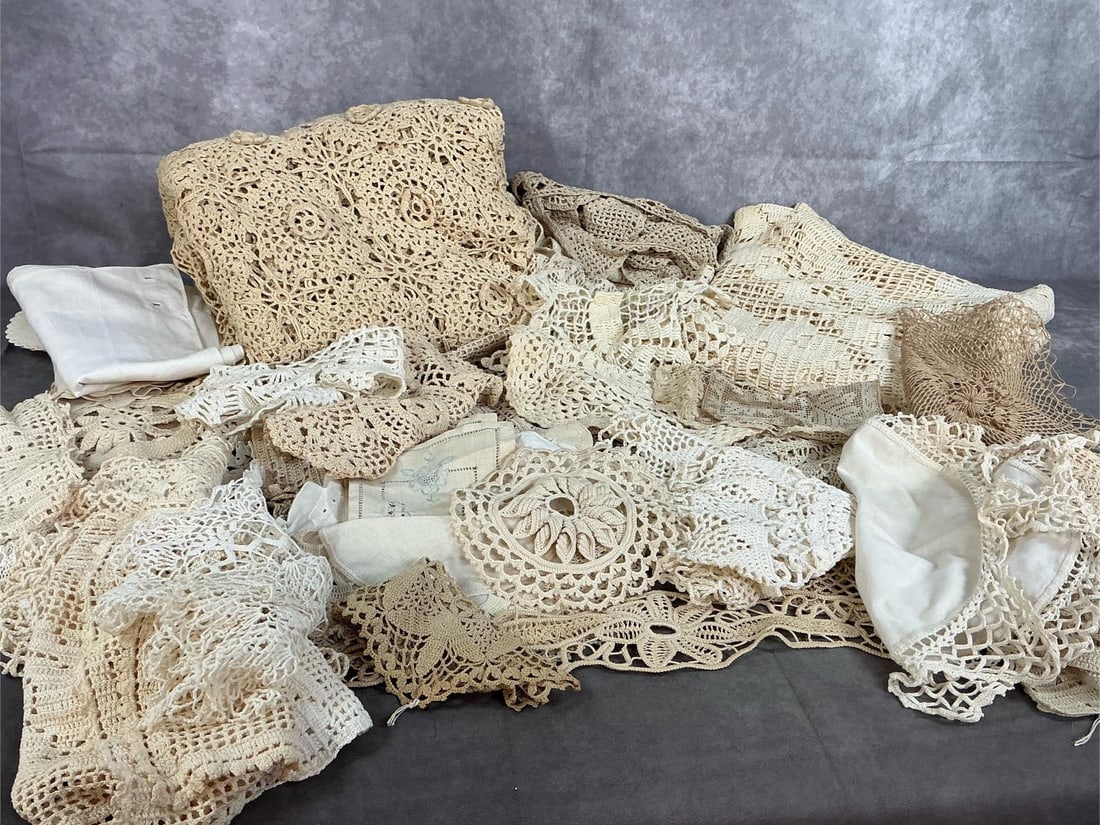 Crocheted Table Spreads & More: Forty-five early to mid century pieces. Two crocheted tablecloths, plus forty- three varied sizes and shapes of spreads, toppers and doilies. Spreads are shabby with age. Tablecloth measures 60