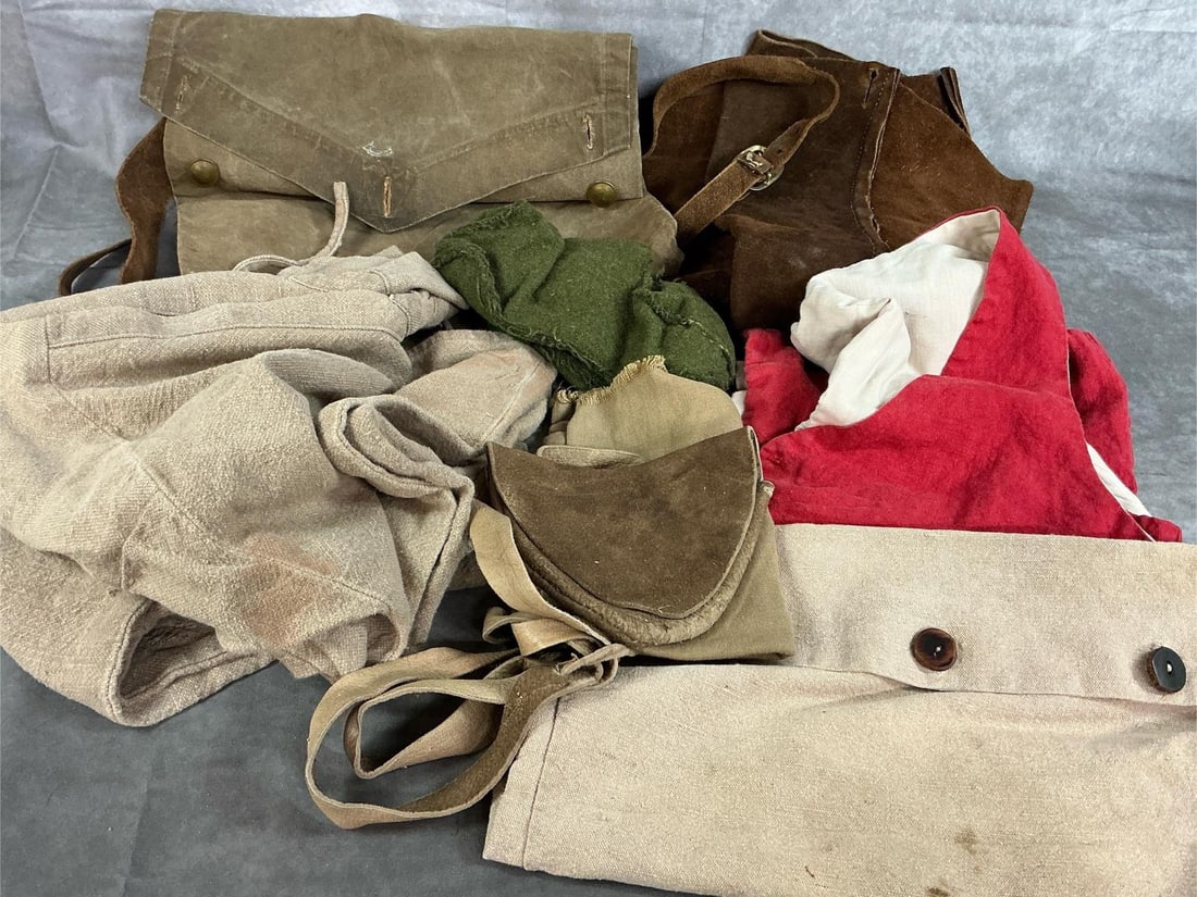 Reenactor's Clothing & Bags: Eight reenactment items. Includes long heavy men's shirt, heavy leather spats, and red vest. Three cloth bags, a leather pouch, and green fabric shoes. Rustic with stains. Long tan shirt measures 36 i