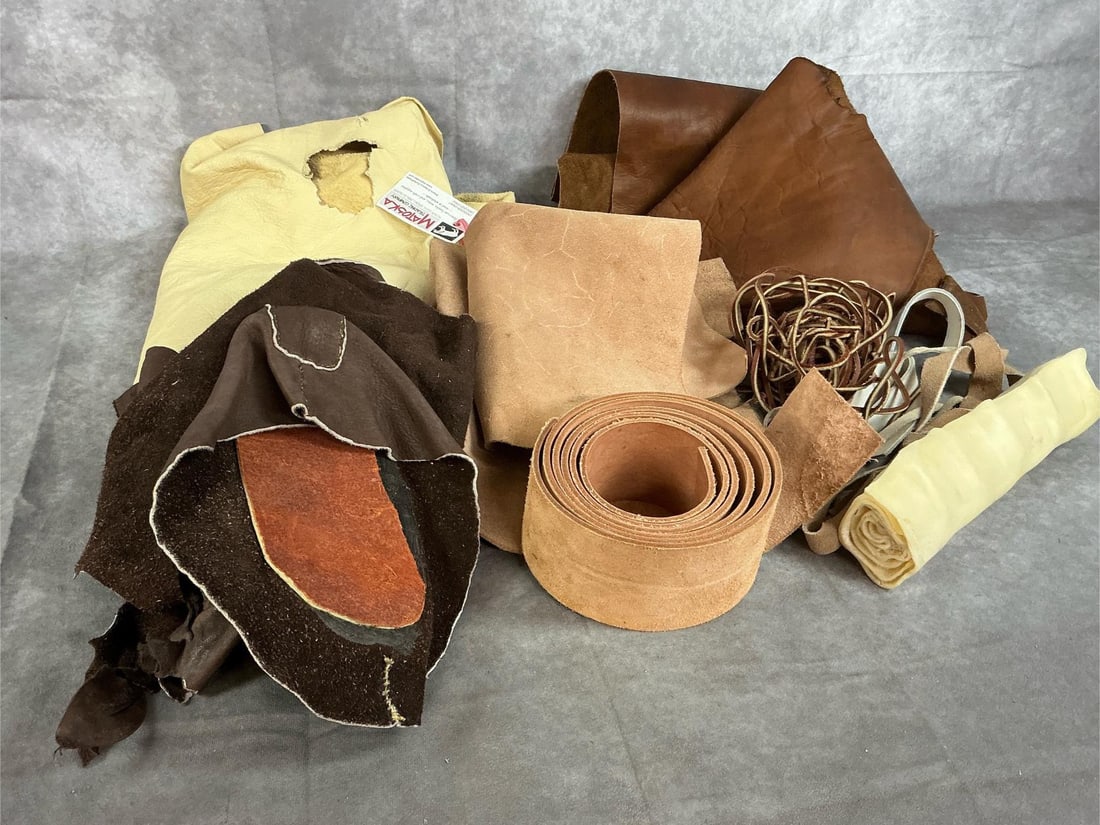 Variety of Leather & Strips: Five pieces of leather or buckskin. Includes leather strips, roll of 3 inch thick leather, and more. Matoska Trading Co light smoke buckskin measures 32 inches wide x 55 inches long.