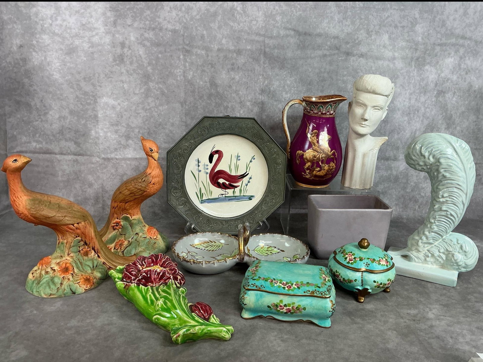 Vases, Plate, Figurines, & More: Eleven early to late 1900s pieces. Flamingo plate with pewter rim from Germany, two hand painted pheasants, floral wall pocket, feather plume vase by Royal Haegar, and Roman art pitcher. Includes 2