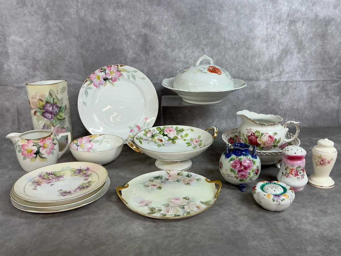 Hand Painted Floral Serving Dishes: Sixteen mid century hand painted pieces. Includes Leuchtenburg, Germany butter dish, five pieces of Noritake, signed Pirkenhammer vase, three Royal Rudolstadt saucers, and more. In good condition.
