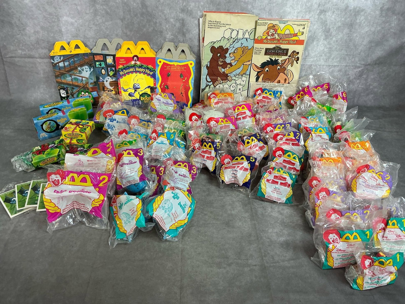 Happy Meal Toys: Seventy McDonald's toys from 1998. Includes Disney Video Favorites, Simba's Pride, and A Bug's Life. Includes bags and boxes. In original packaging. Average size is 4 inches x 5 inches.