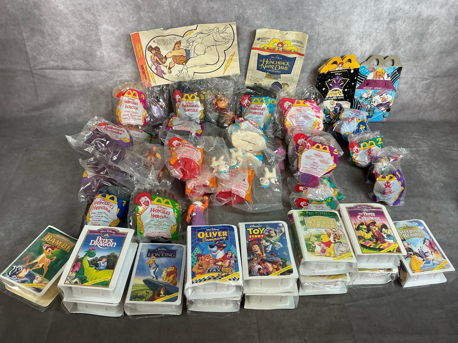 McDonald's Toys: Forty-five Happy Meal toys from 1996. Includes Hercules, Hunchback of Notre Dame, Mighty Ducks, and Disney Movie keepsakes. In original packaging. Includes bags and boxes.