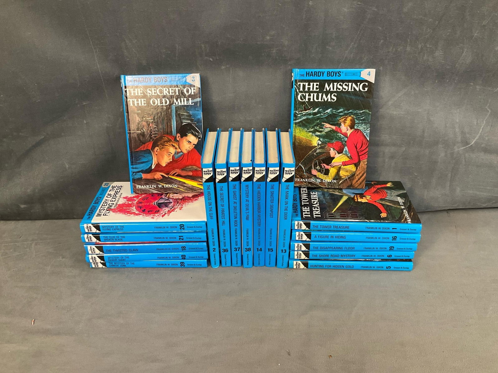 The Hardy Boys Books: Set of nineteen Hardy Boys children's books by Franklin W. Dixon. 2002 reprints. Titles include, “The Tower Treasure “, and “ The Secret Of Pirates' Hill”. Good condition. Measures 5