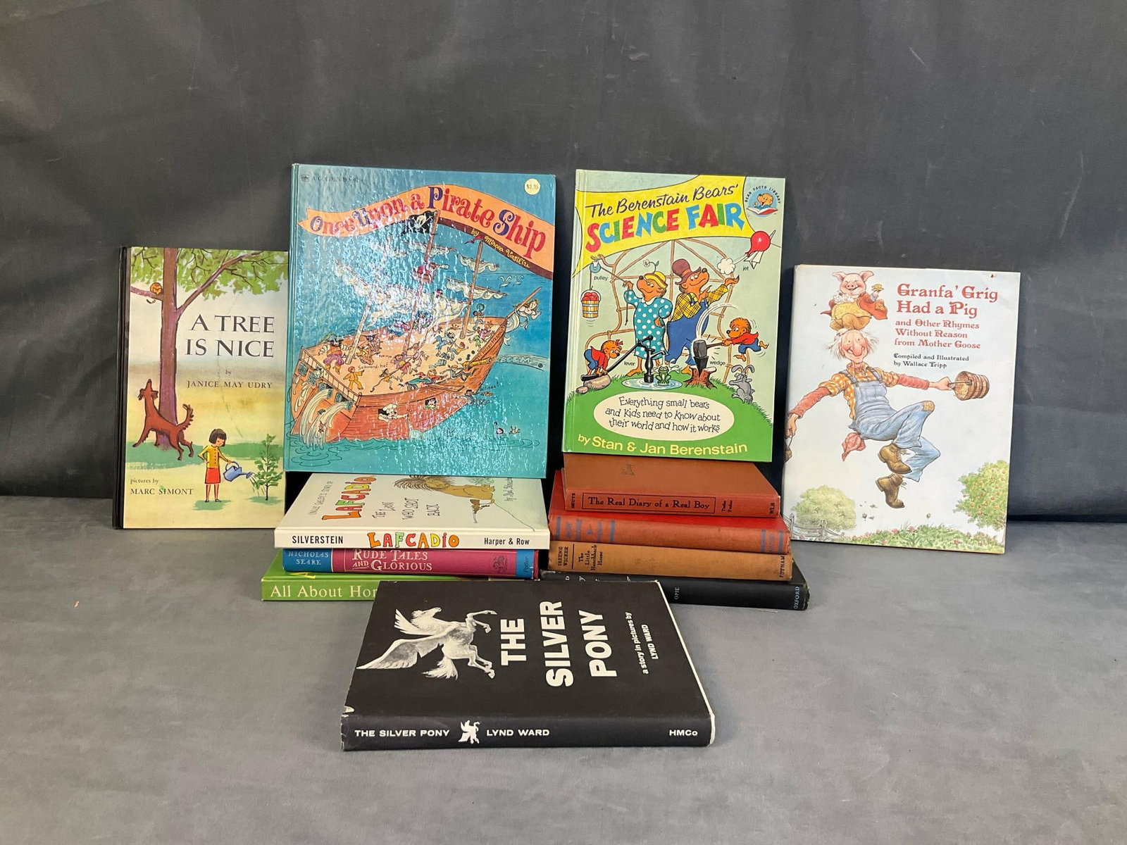 Children's Books: Lot of twelve mostly 1960's vintage collectible children's books. Titles include, “Lafcadio” by Shel Silverstein, “The Bernstein Bears' Science Fair”, “All About Horses”, and