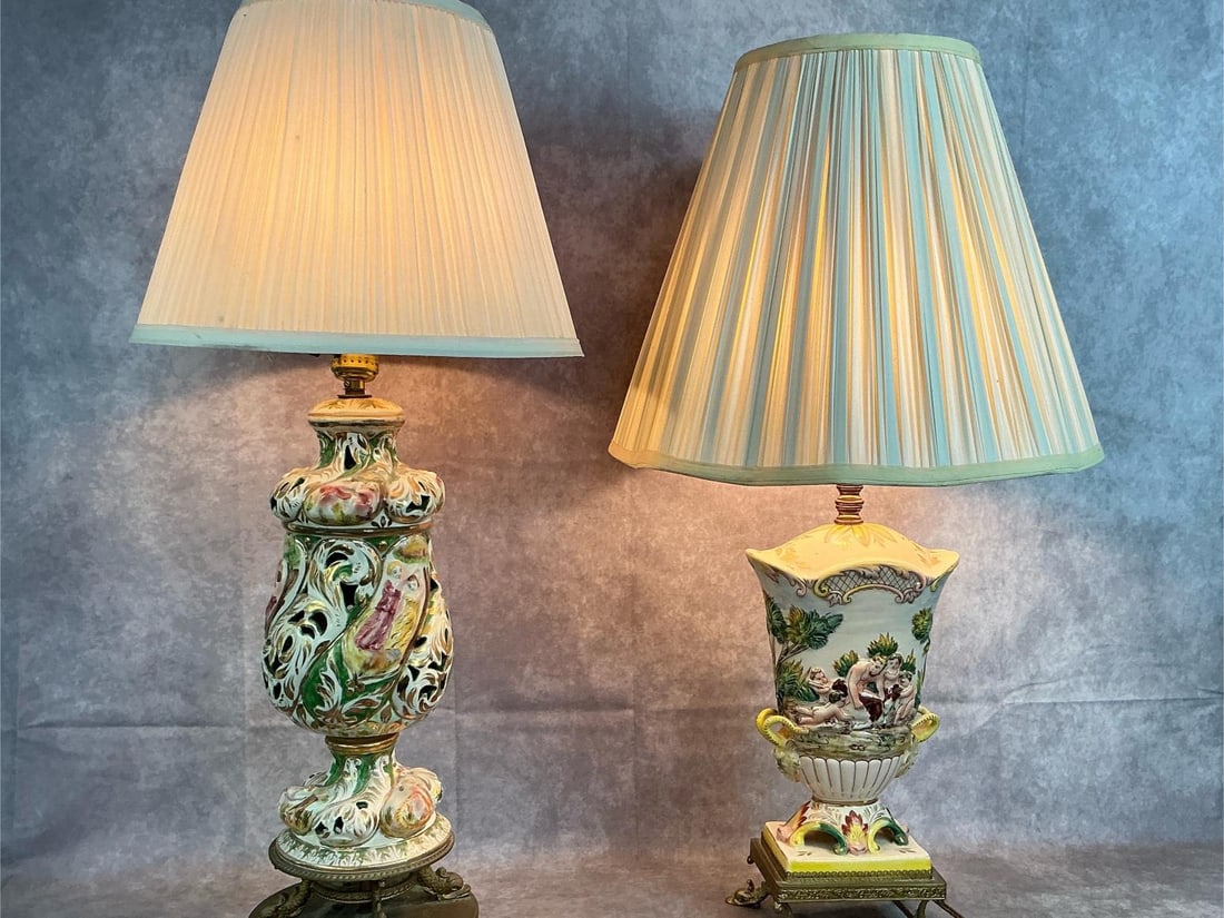 Italian Baroque Lamps: Two mid century lamps. High relief hand painted porcelain lamps. Baroque style with gilt and Victorian style art. Both work. The cylinder style lamp has a loose bulb base. Otherwise in good