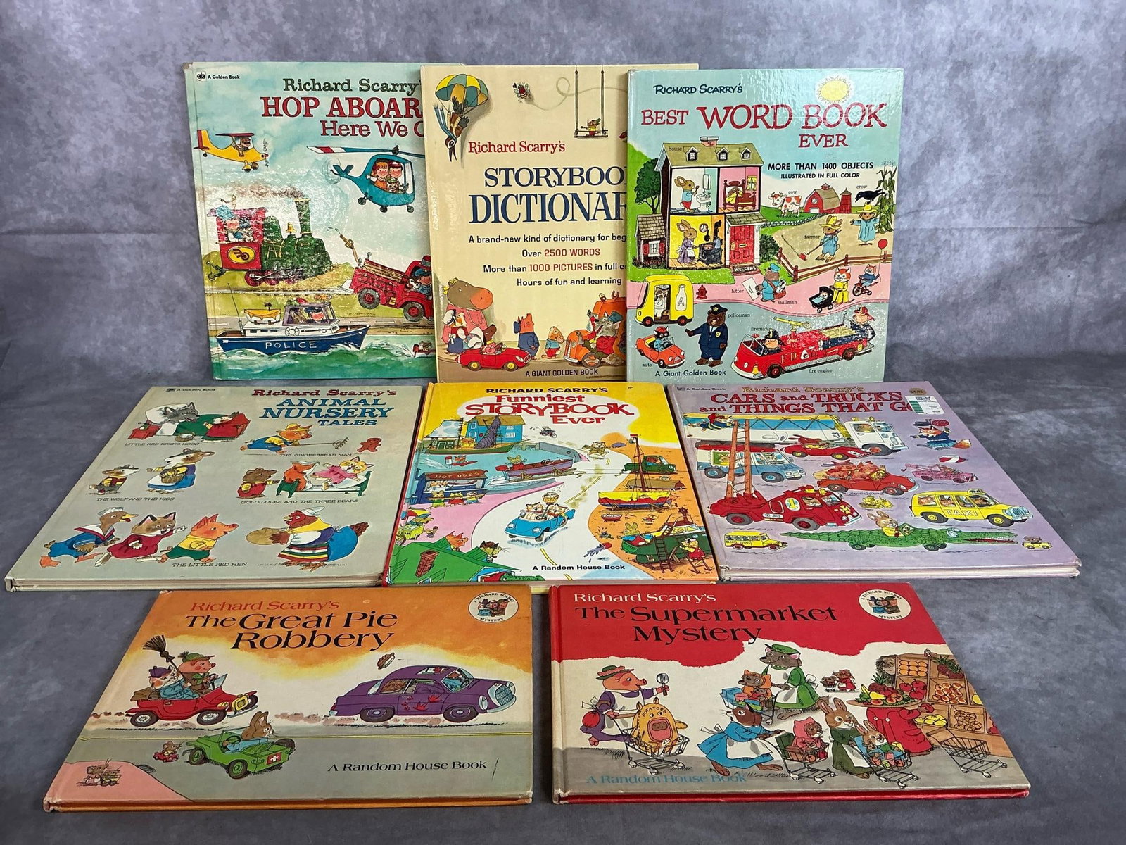 Richard Scarry Books: Eight Scarry books from 1969- 1979. Includes Storybook Dictionary, Animal Nursery Tales, Hop Aboard and more. Hardbacks children's books. In good condition. Largest measures 9.5 inches wide x 12.75