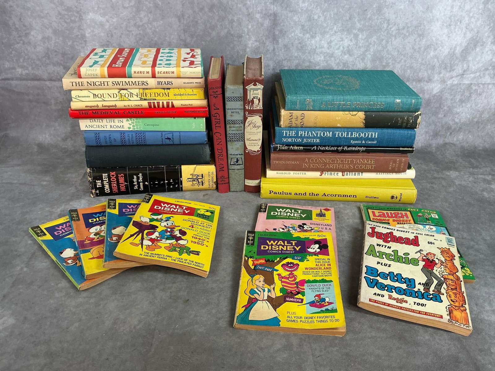 Teen Books: Nineteen hardcovers and eight paperbacks from early to late 1900s. Six Gold Key Walt Disney and two Comics Digest Archie books. Hardbacks include The Little Princess, Sherlock Holmes, Jo's Boys,