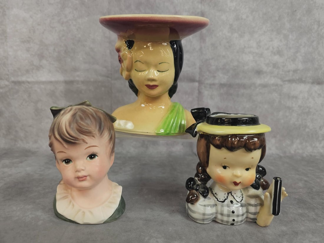Head Vases: Three vintage head vases, Polynesian lady is made by Shawnee Pottery, one made in Japan, and one unmarked. All in good condition. Largest measures 5.25 inches wide x 2.75 x 5.75 inches tall.