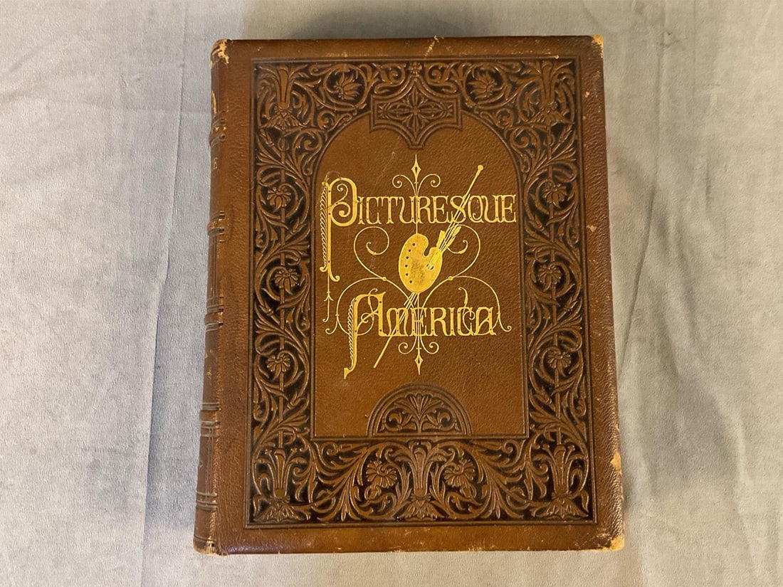 Picturesque America Book: Published 1874 "Picturesque America Volume ll " book. Gold tooled full brown leather binding, gilt edged with wood and steel engravings. Published by D. Appleton and Company, New York. Some wear to sp