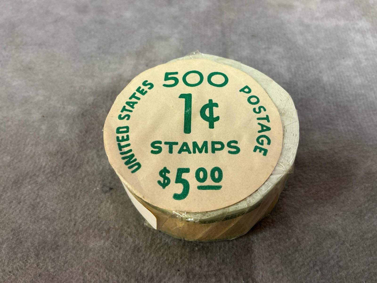 Vintage 1cent Sealed Roll Stamps: 1963 1cent U S Postage stamps. Sealed roll of 500 with Andrew Jackson in mint, unopened condition. Measures 2 inches across.