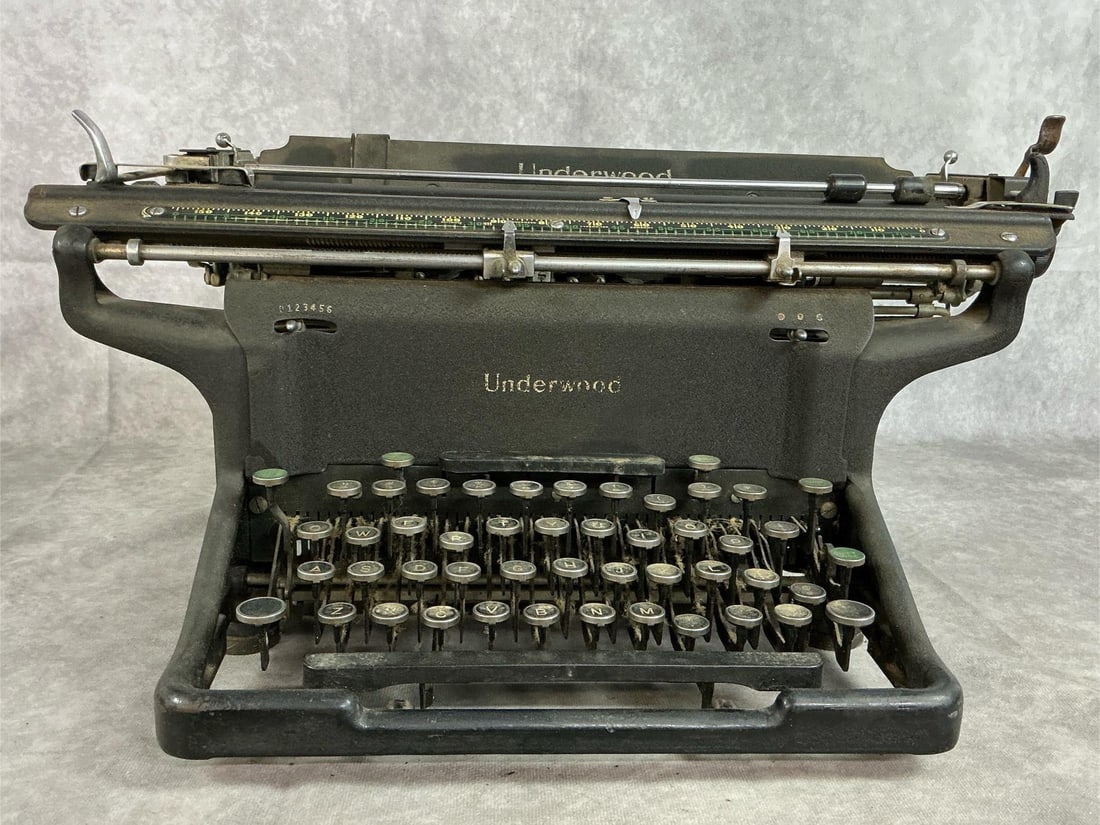 Underwood Manual Typewriter: Early 1900's Underwood manual typewriter. Standard heavy steel frame. Needs cleaning, appears to work. Measures 19 inches wide x 12.5 x 9 inches tall.