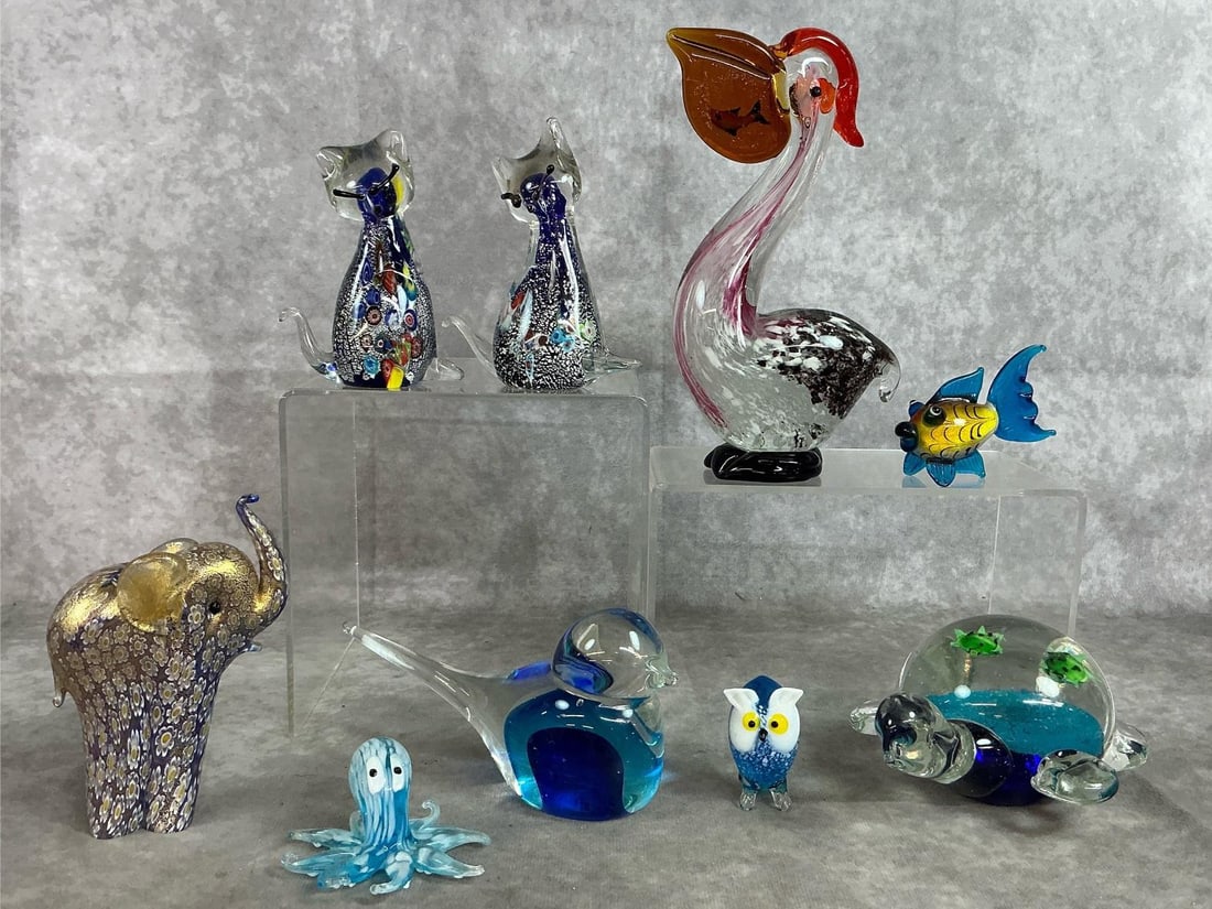 Collectible Glass Animals: Nine glass figures. Lenox elephant and cats are Murano millefiori. Art glass pelican, turtle, bird, and more. All in good condition. Pelican measures 2 inches wide x 7.5 inches tall.