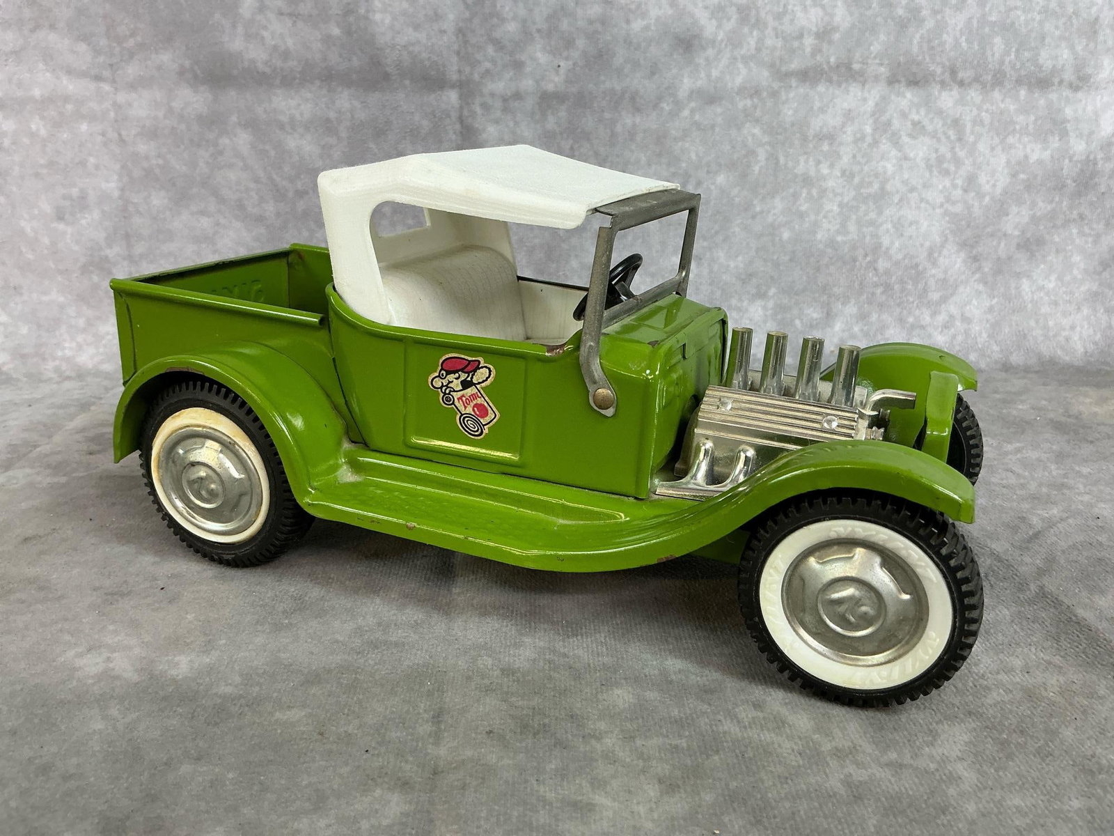 Nylint Hot Rod Pickup: 1970 Nylint pressed metal pick up truck. Green with white plastic top and hubcaps with "N" embossed. A little rust and paint wear, otherwise in good condition. Measures 10 inches long x 5 x 4.75