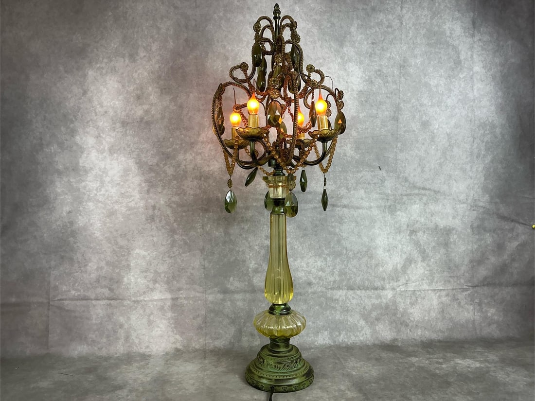 Green Chandelier Table Lamp: Vintage green glass and lucite chandelier lamp. Electric Hollywood Regency style with four bulbs and green pendant prisms. Works. In good condition. Measures 11 inches wide x 33 inches tall.