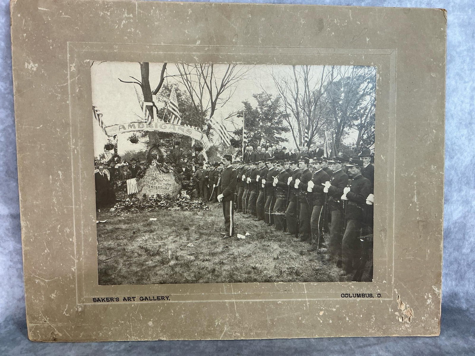 Ceremony for Confederate Soldiers of 1861 War: June 7, 1897 picture taken at Camp Chase, Ohio. Ceremony pictures soldiers and stone proclaiming "2260 Confederate Soldiers of 1861 War buried in this Enclosure ". Matted black and white photo with