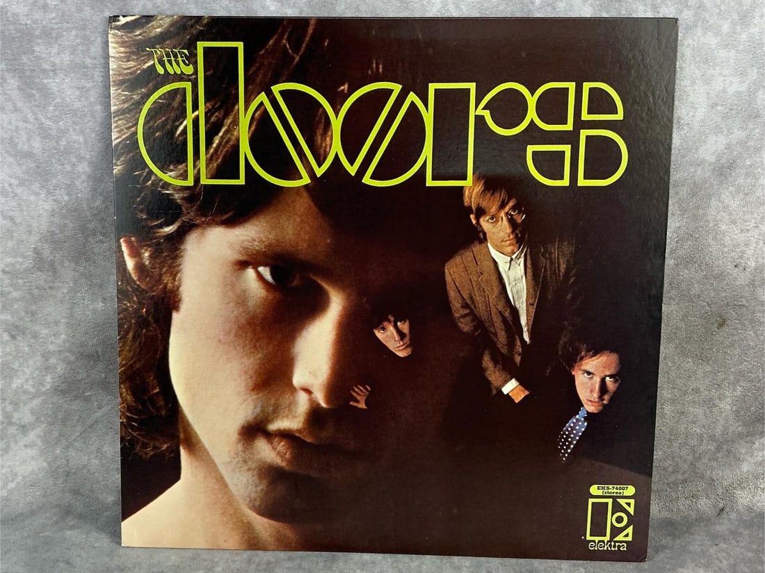 The Doors Vinyl: 1967 self titled The Doors vinyl. In good condition with original sleeve. Measures 12.5 inches wide x 12.25 inches tall.