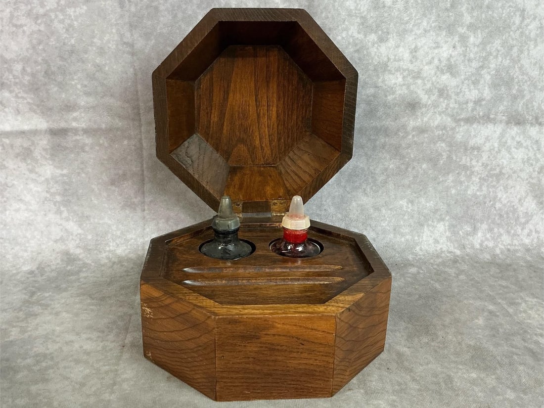 Antique Walnut Writing Set: Victorian style walnut writing set. Octagonal hinged caddy holds ink in glass bottles, with slots for writing pens. Slight wear, otherwise in good condition. Measures 7.5 inches wide x 7 x 6 inches