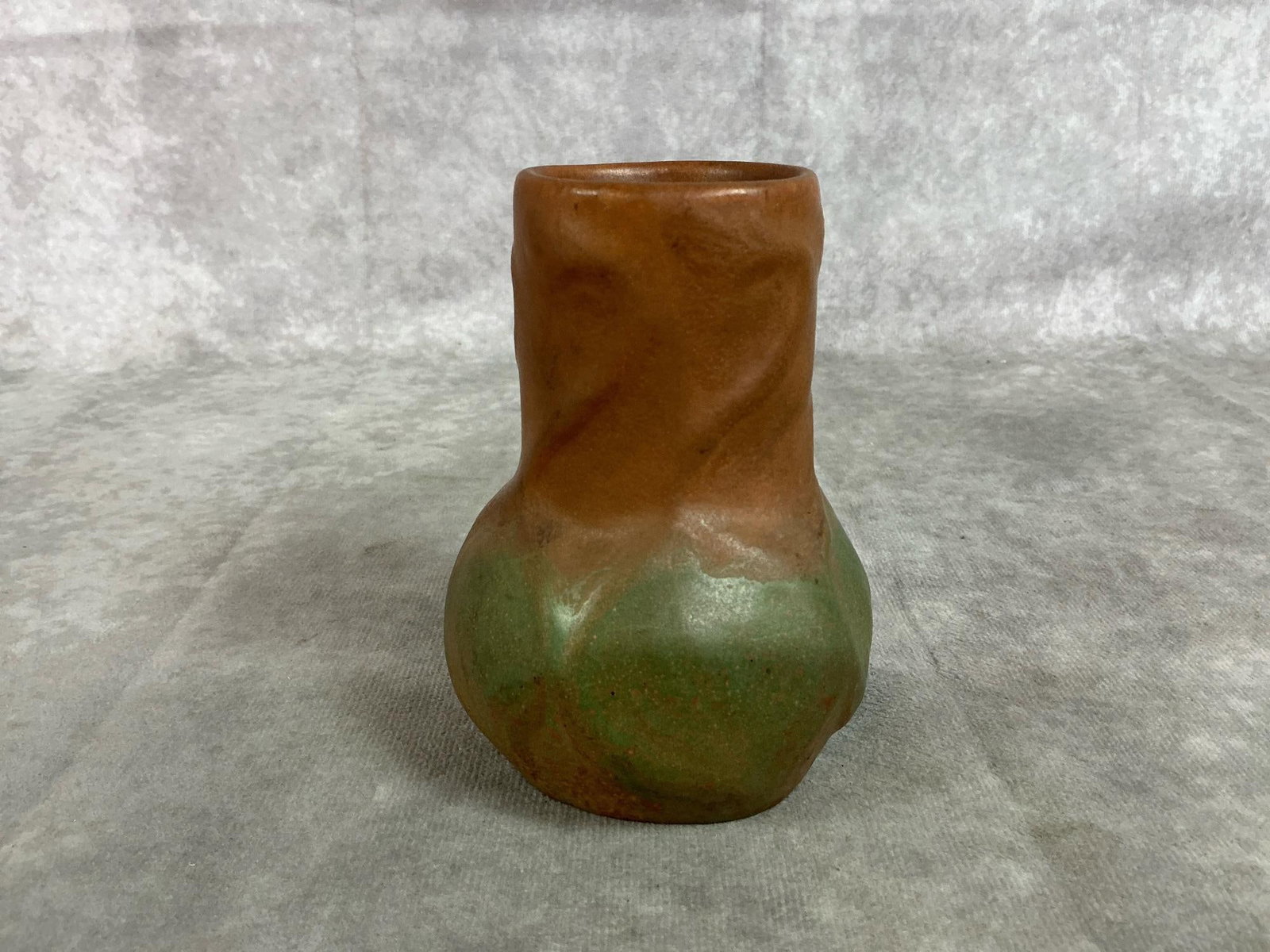 Van Briggle Vase: 1920's art pottery vase. Van Briggle "onion bulb" vase. Clay with brown and green matte glaze. Measures 3.25 inches in diameter x 4.25 inches tall.