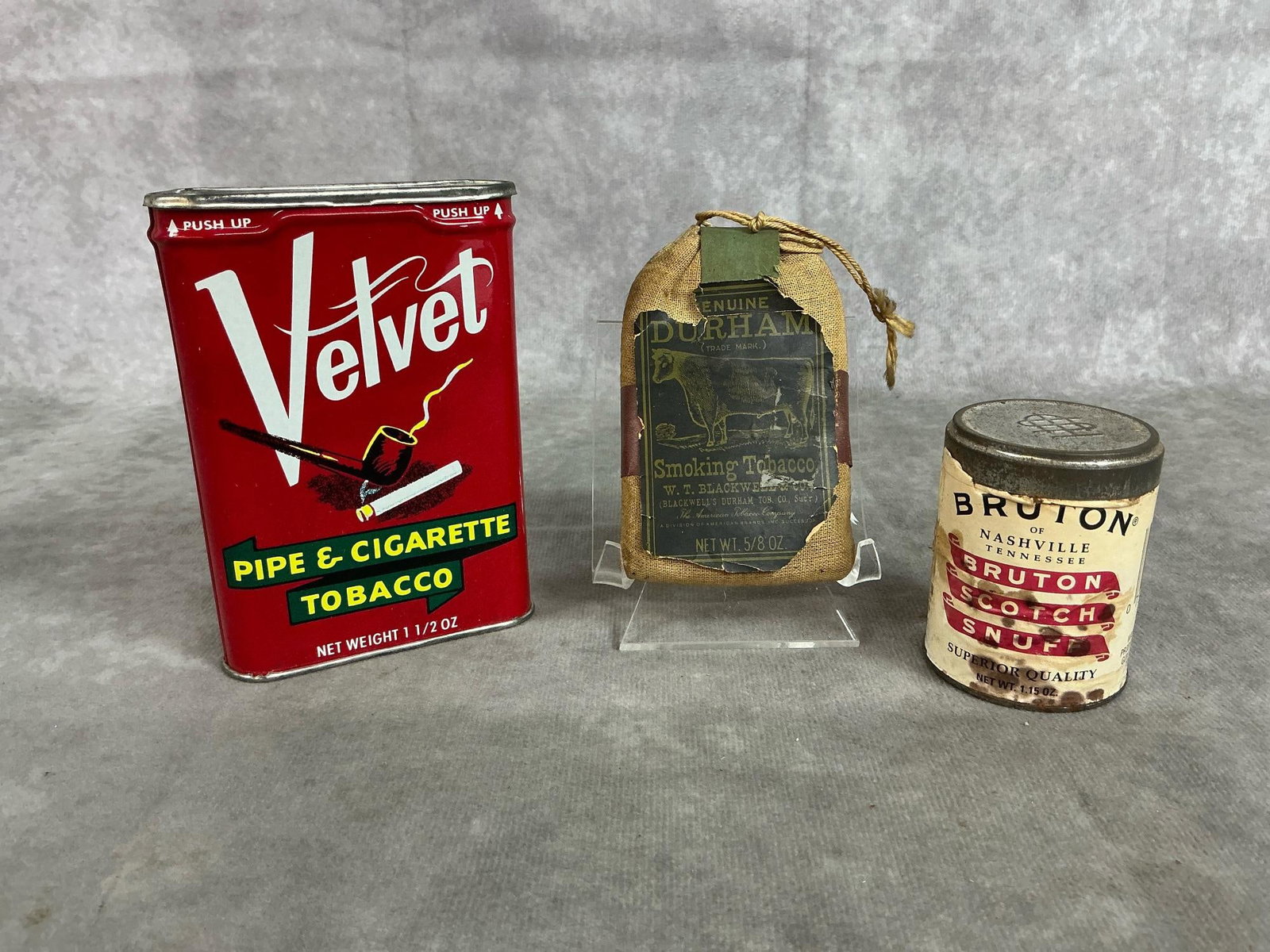 Vintage Tobacco: Three mid 1900's tobacco products. Includes Velvet can tobacco, bagged Bull Durham Smoking tobacco with cigarette papers, and Burton Scotch Snufff can. Labels are tattered and bag stained. Velvet can 