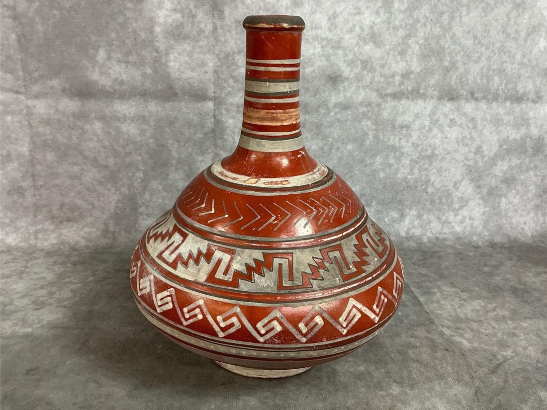 Mexican Water Jug: Vintage Mexican water jug or display piece. Folk art made with natural clay. Some color fading and small scratches, otherwise in good condition. Measures 7.5 inches in diameter x 9 inches tall.