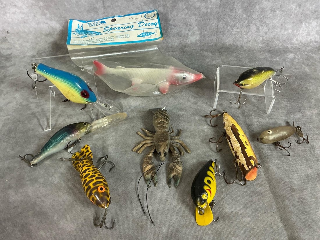 Vintage Fishing Lures: Nine vintage lures. Includes Spearing decoy, Arbogast Mud Bug, Zenith Azu-lure, Cordell Big-O, Heddon Tiny Torpedo and more. Some wear and rust present. Spearing Decoy package measures 5 inches wide