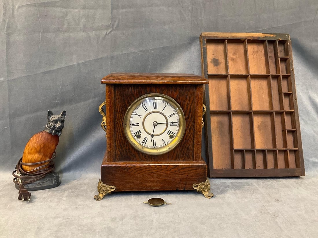 Mantel Clock: Lot of three vintage collectibles. One late 19th century - early twentieth century oak mantel clock. Unmarked. Not tested, no key, pendulum present. One late twentieth century spelter metal cat lamp.