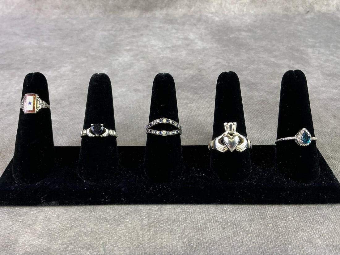 Sterling Silver Rings: Lot of five sterling silver rings. All in good condition, stamped 925 with sizes of each shown in pictures. Total weight 0.73 ozt.