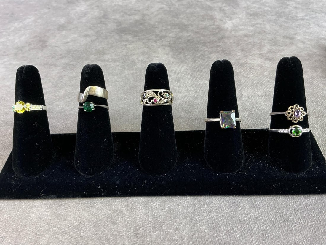 Sterling Silver Rings: Lot of seven sterling silver rings. All in good condition, stamped 925 with sizes of each shown in pictures. Total weight 0.58 ozt.