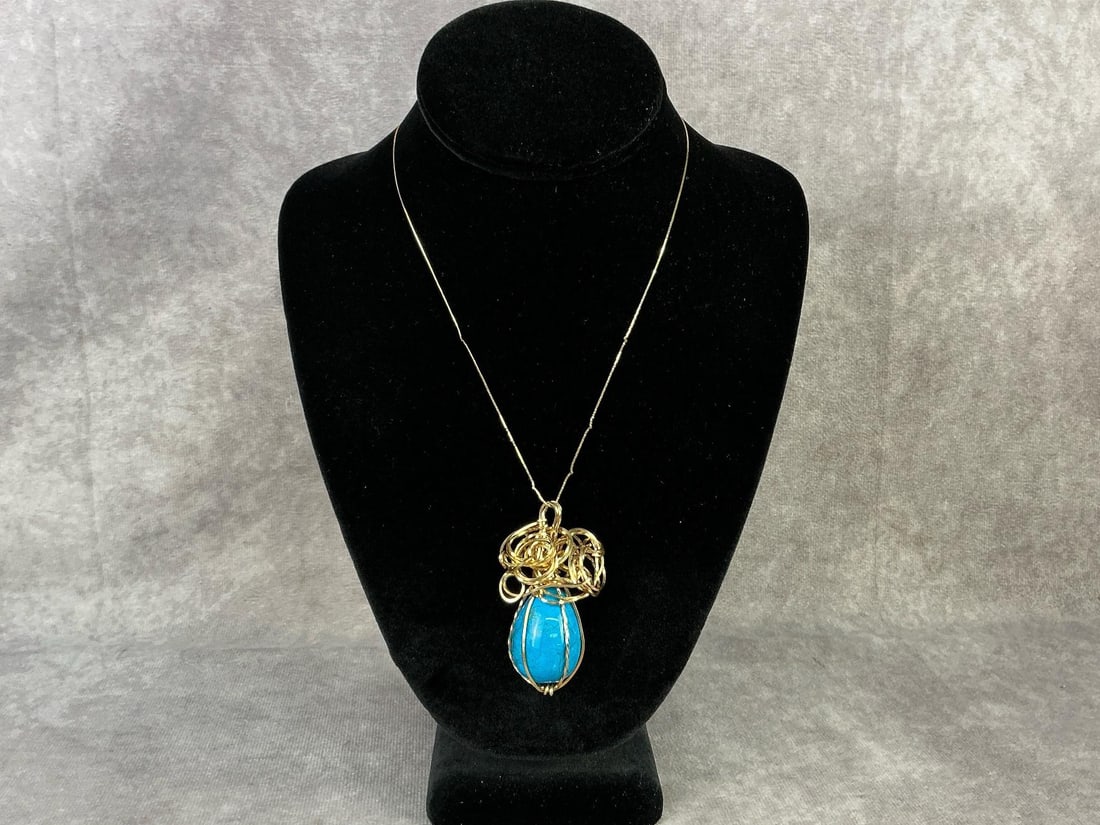 Gold Necklace & Pendant: 14kt gold chain made in Italy stamped on clasp. Handmade 10kt gold cage pendant with a turquoise stone egg. Pendant is unmarked but tested and held to 10kt. 14kt chain total weight 1.2 dwt and 10kt to