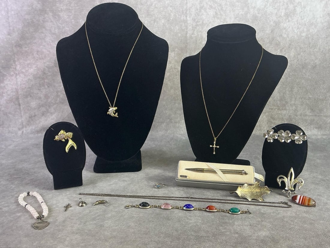 Sterling Silver Jewelry: Lot of Sterling silver jewelry including necklaces, brooches, bracelets, and more. All in good condition with oxidation present, most stamped or scratch tested. Total weight 2.51 ozt.