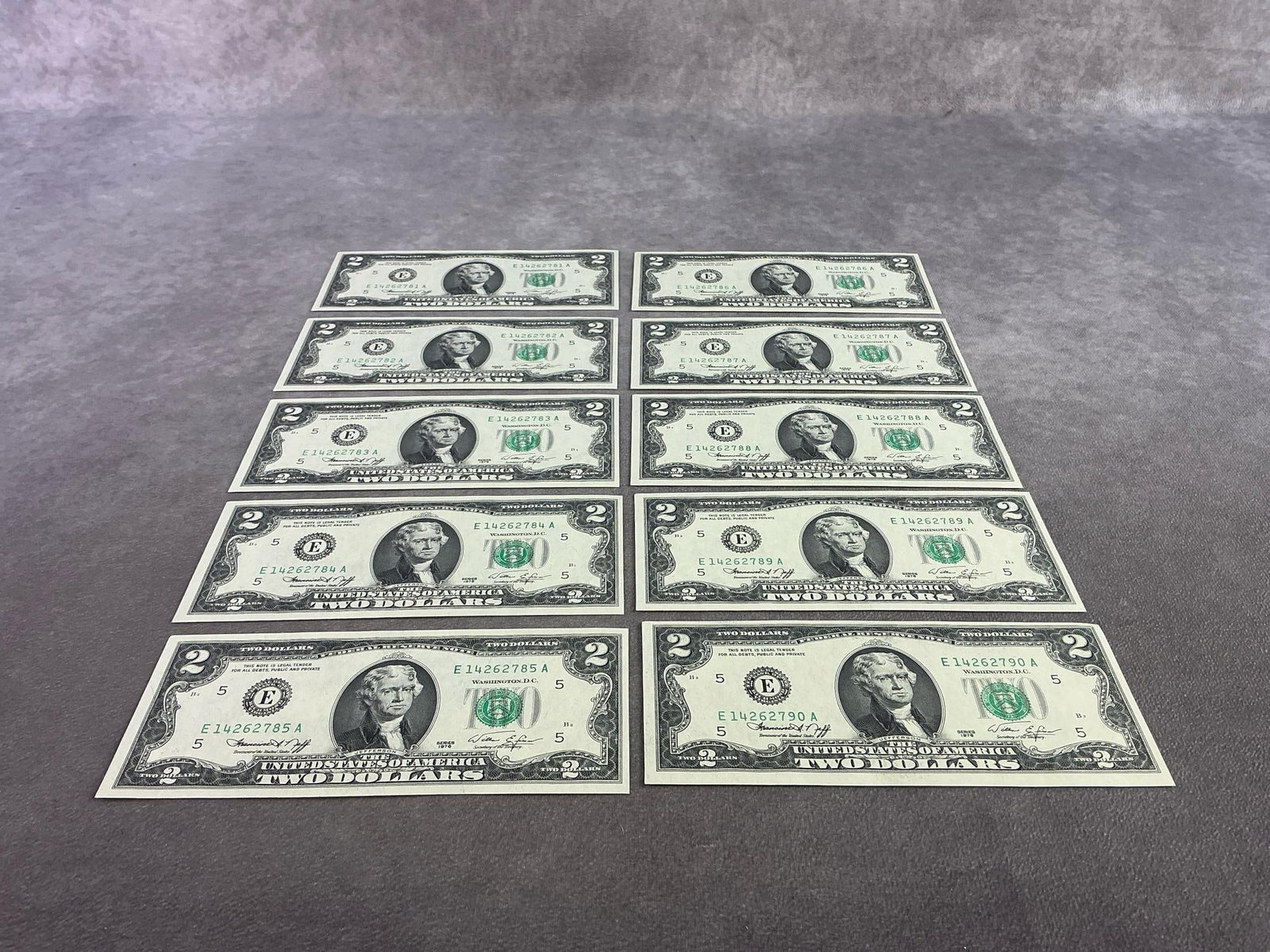 Jefferson Two Dollar Bills: Lot of ten Thomas Jefferson two dollar bills running in sequential serial numbers. All in good condition and appears to be uncirculated. Each bill measures 6.15 inches wide x 2.65 inches tall.