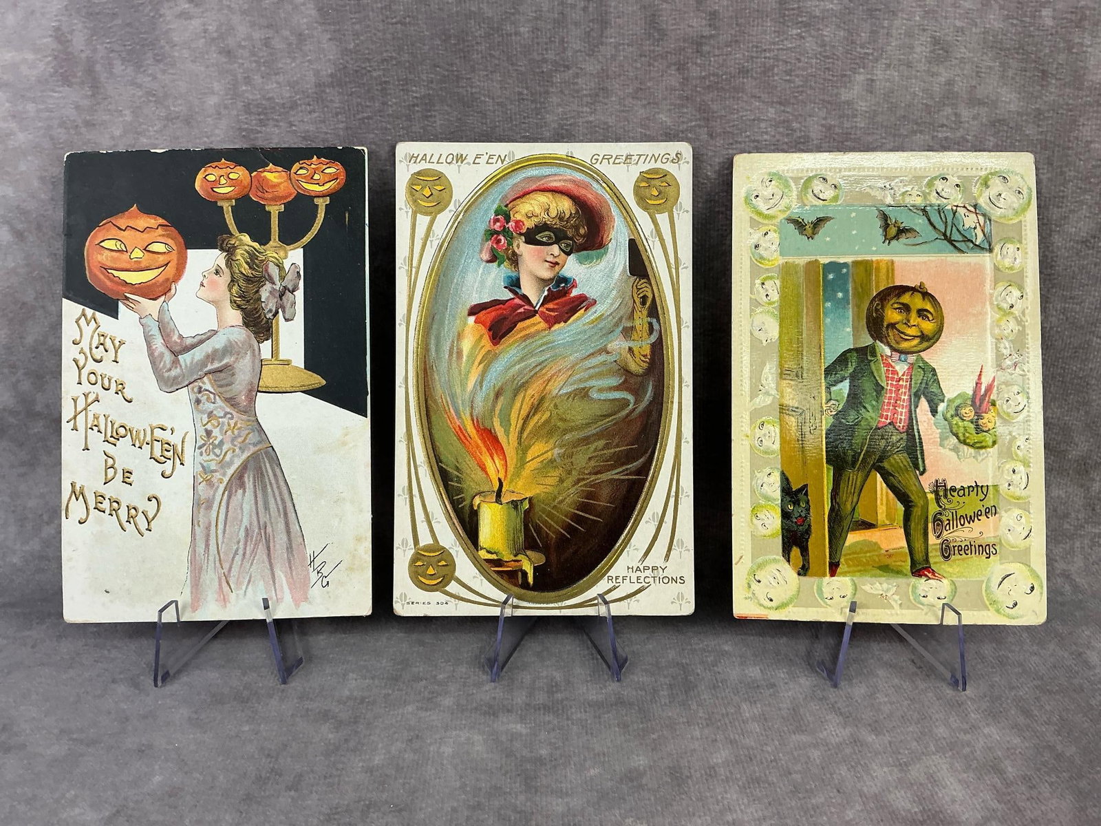 Halloween Postcards: Three circa 1910 Halloween postcards. Includes one by H. B. Griggs, anthropomorphic pumpkin head by Gottschalk, and "Happy Reflections" by MAP Company. All have foxing and soft edges and corners.